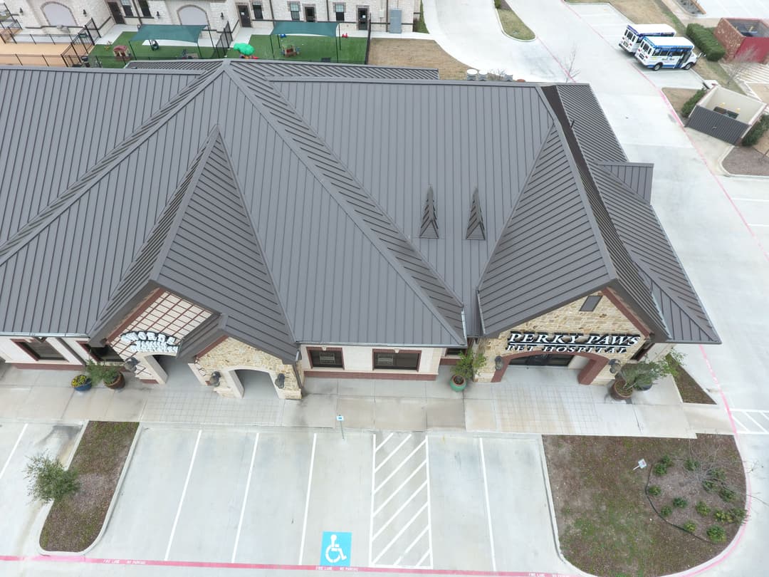 Aerial view of Perry Park senior housing facility with modern architecture and accessible parking.