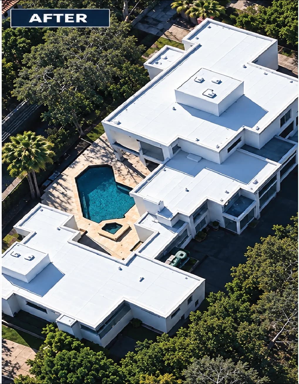 Aerial view of modern white house with pool and landscaped yard. Renovated outdoor space.